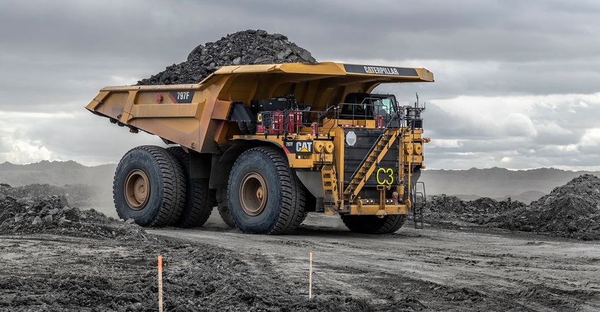 797F mining truck from Caterpillar shown with a driver