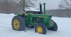 John Deere 4320 tractor in snow