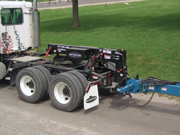 New hitch converts semi for planter, implement transport