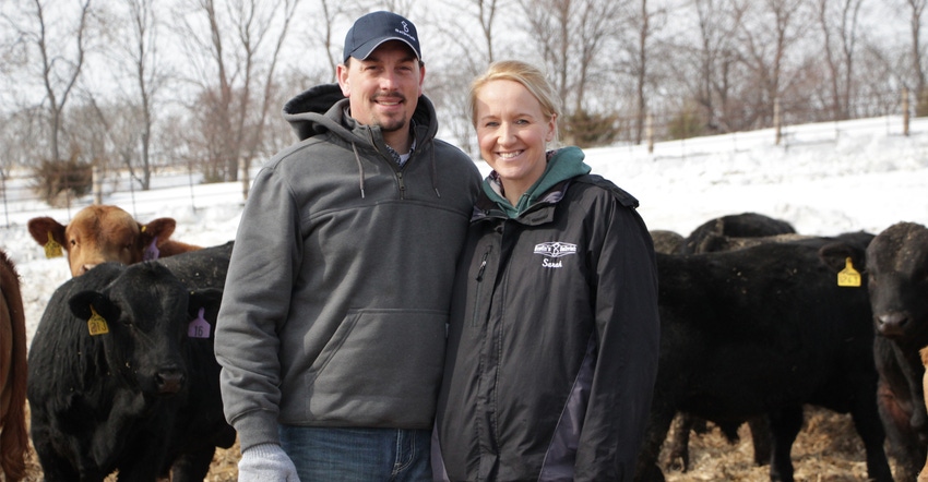 Sarah and Richie Heinrich of Medina, N.D standing in front of cattle Sarah and Richie Heinrich of Medina, N.D standing in front of cattle