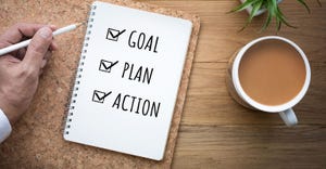 Goal plan action written on notepad
