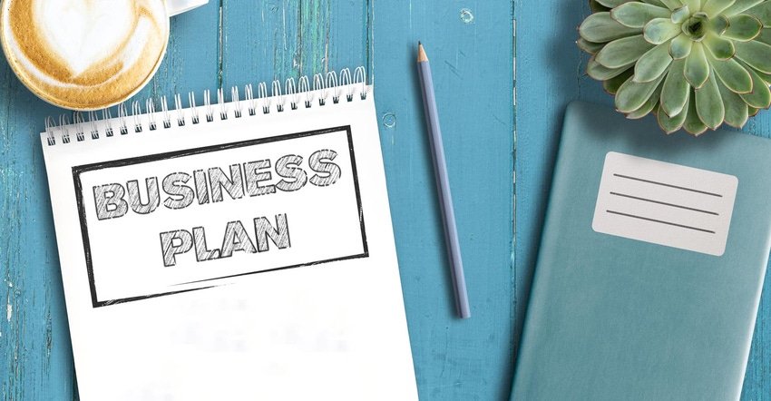 business strategy concept, top view of business plan on notepad on wooden table