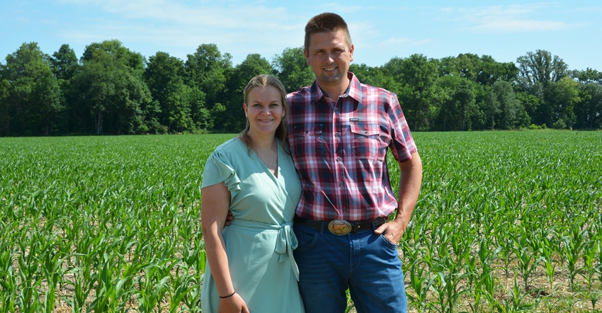 D’ejanne and Johan de Groot standing in front of a young cornfield