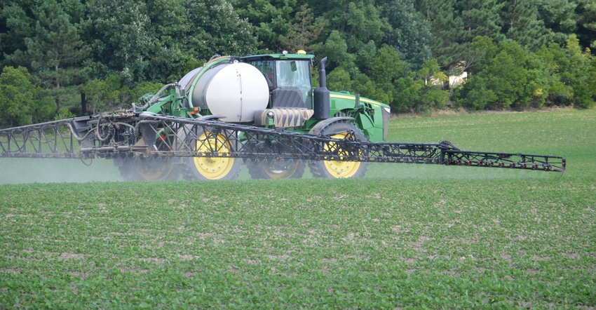 sprayer in soybean field