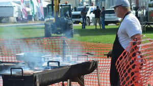 beef burgers being grilled from one of the HHD food vendors