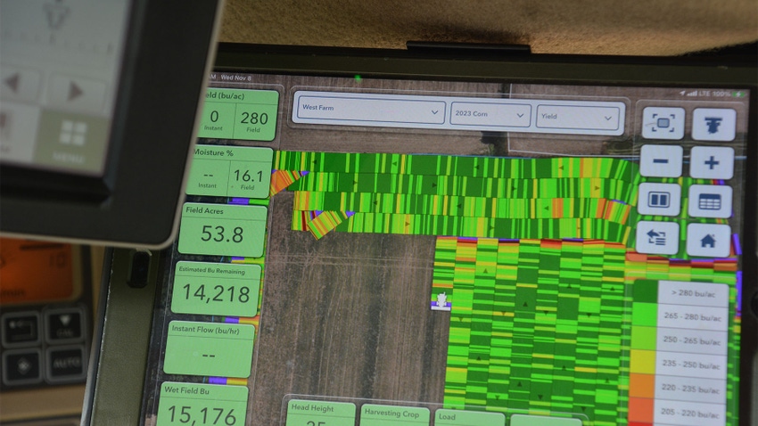 A close-up of a yield monitor showing data from a cornfield
