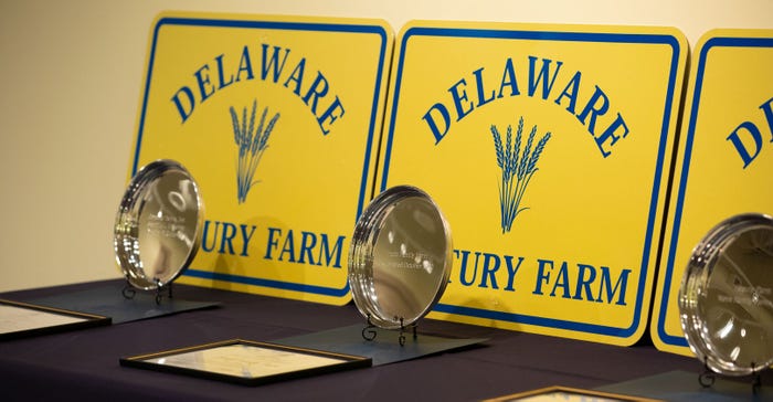 Delaware Century Farm families receive a sign for their farms, an engraved plate, a certificate and legislative tributes Delaware Century Farm families receive a sign for their farms, an engraved plate, a certificate and legislative tributes