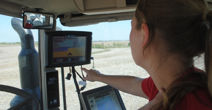 Woman farmer in a combine