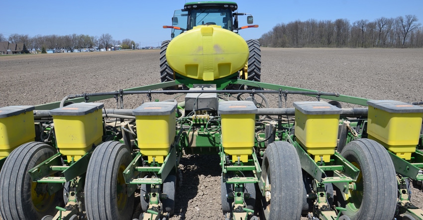 view of planter in field from behind