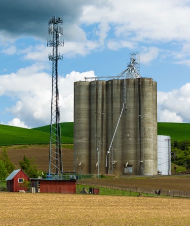 View of cell tower adjacent to grain elevators