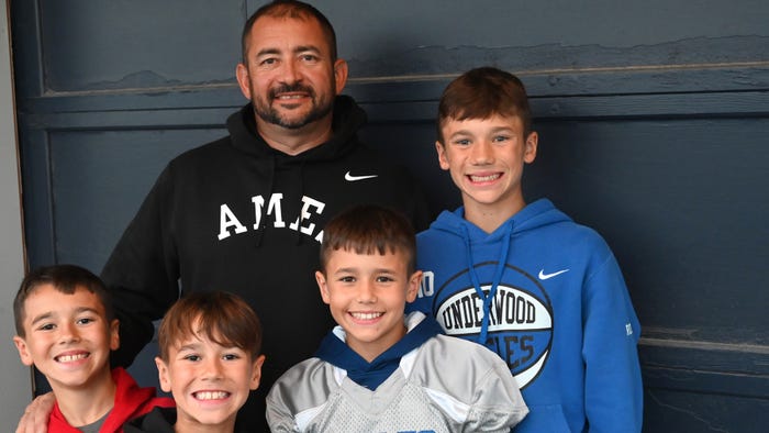 Kevin Ross and his four sons