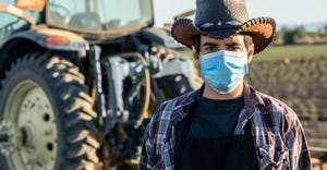 Close up of a farmer wearing a protective face mask