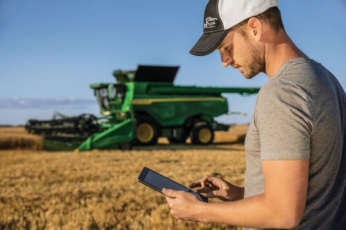 Farmer uses the mobile version of the new John Deere Operations Center from the field