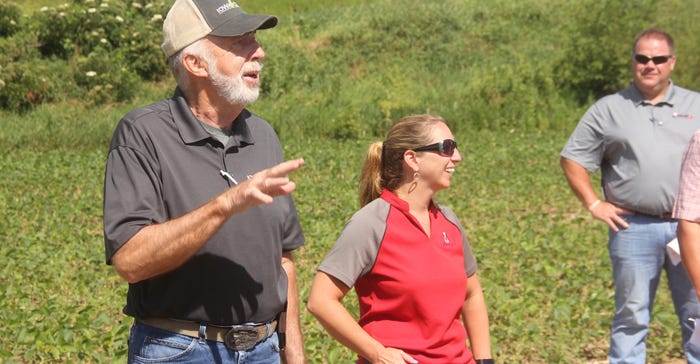 Larry Buss  a Harrison County grower talking to community people about herbicide resistance