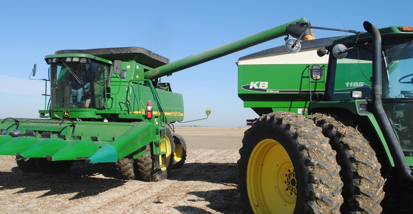 Combine unloading grain