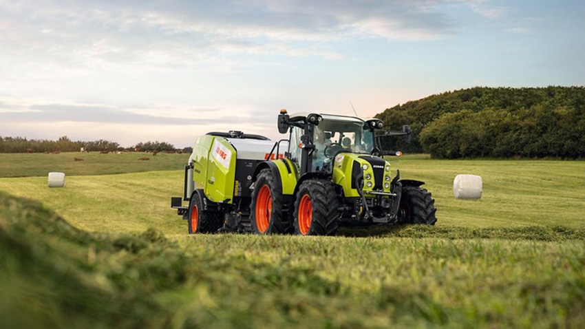 Claas tractor and baler in field