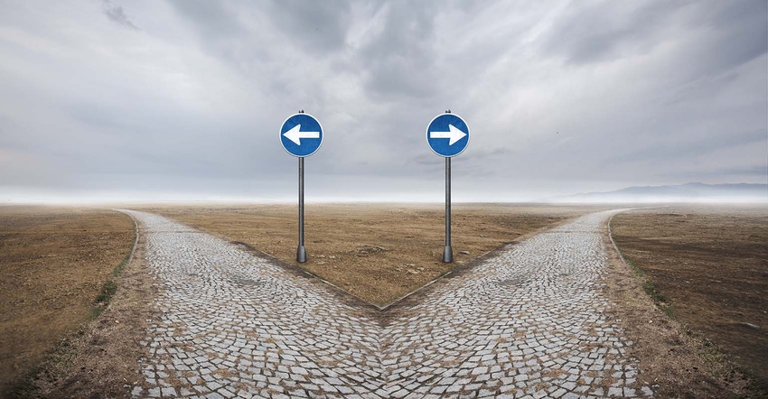 two road signs pointing opposite directions two road signs pointing opposite directions