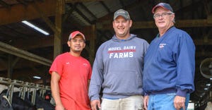 Dan Potterton, A.I. technician, with customers Kyle Levetzow and Wilfredo Gutierrez, Model Dairy Farms, Dodgeville, Wis.