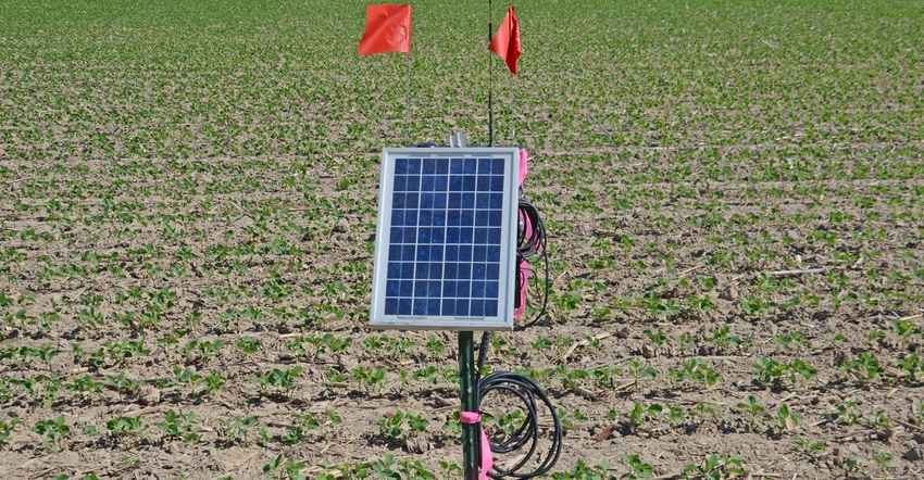 solar-powered soil probe in a field