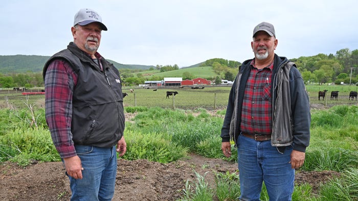 Bill and Jim Martin standing on their farmland