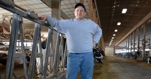 Pennsylvania dairy farmer Reid Hoover stands in dairy barn