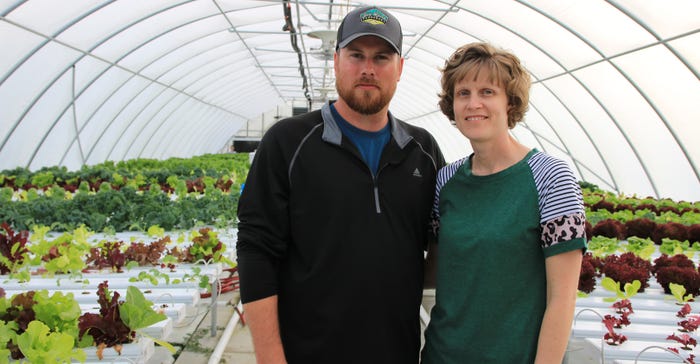  Andrew and Heather Spray of Joy Lane Produce in West Salem, Ill., stand inside greenhouse