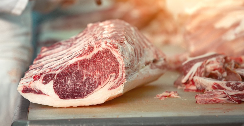 wagyu beef being cut by butchers