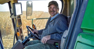 Rod Weinzierl sitting in cab of combine