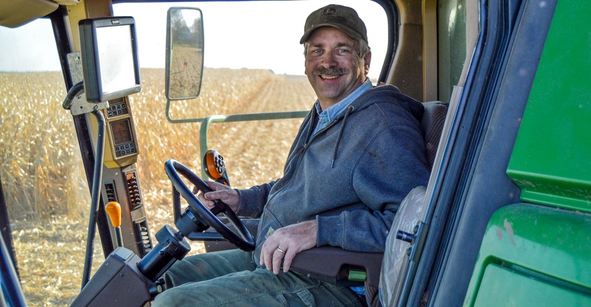 Rod Weinzierl sitting in cab of combine