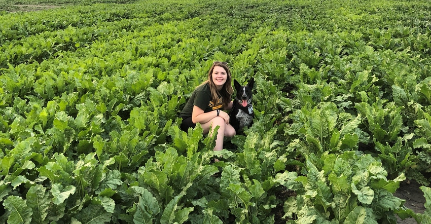 Sarah McNaughton In field with dog