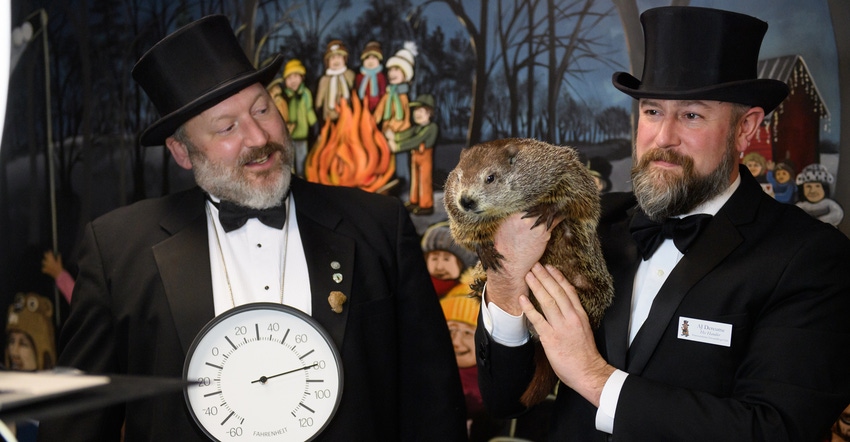 Punxsutawney Groundhog Club Inner Circle Members Jason Gursky and official handler, AJ Dereume and Punxsutawney Phil