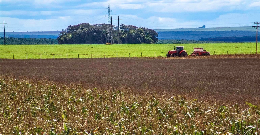 tractor with planter in soy and corn field in Brazil