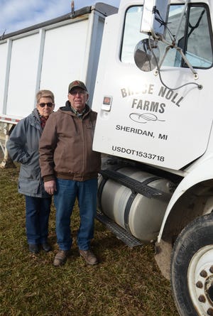Bruce Noll,  with his wife, Jill, standing next to Bruce Noll truck