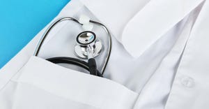 Stethoscope in pocket of medical gown.
