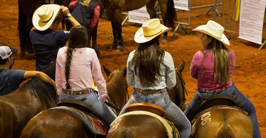 girls on horses at a rodeo