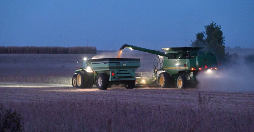 Soybean field with combine during harvest