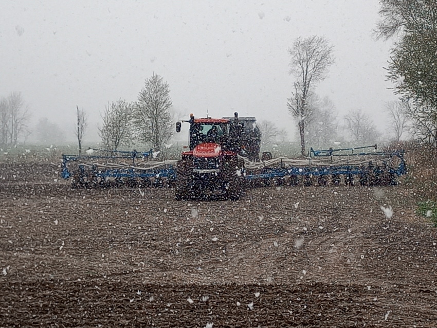 Planter in the field with snow flying