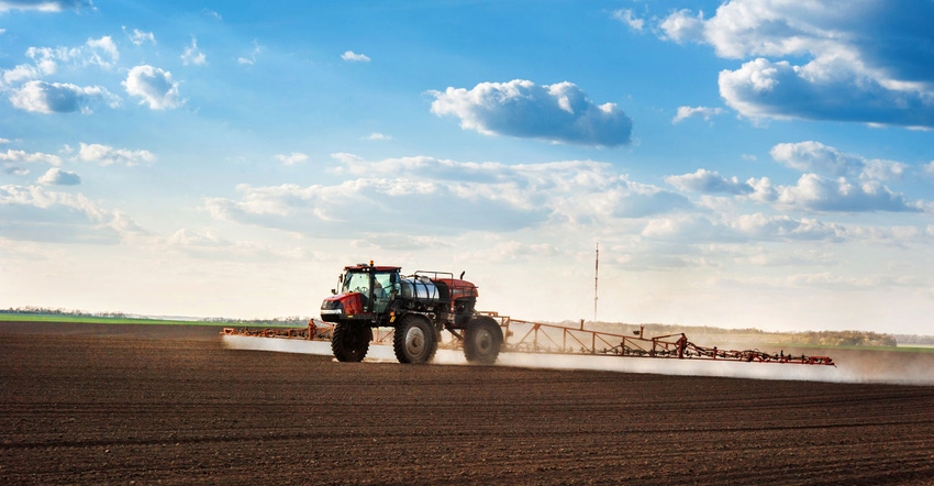 Sprayer equipment working a field