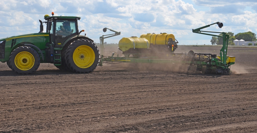 John Deere tractor fertilizing field