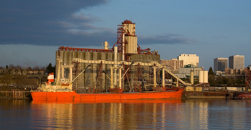 Cargo ship loading grain for transport 