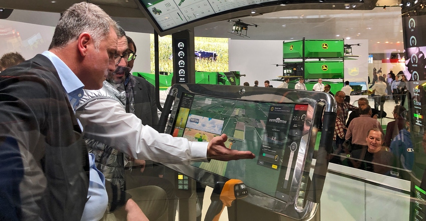 John Deere prototype cab with two large monitors displayed at Agritechnica