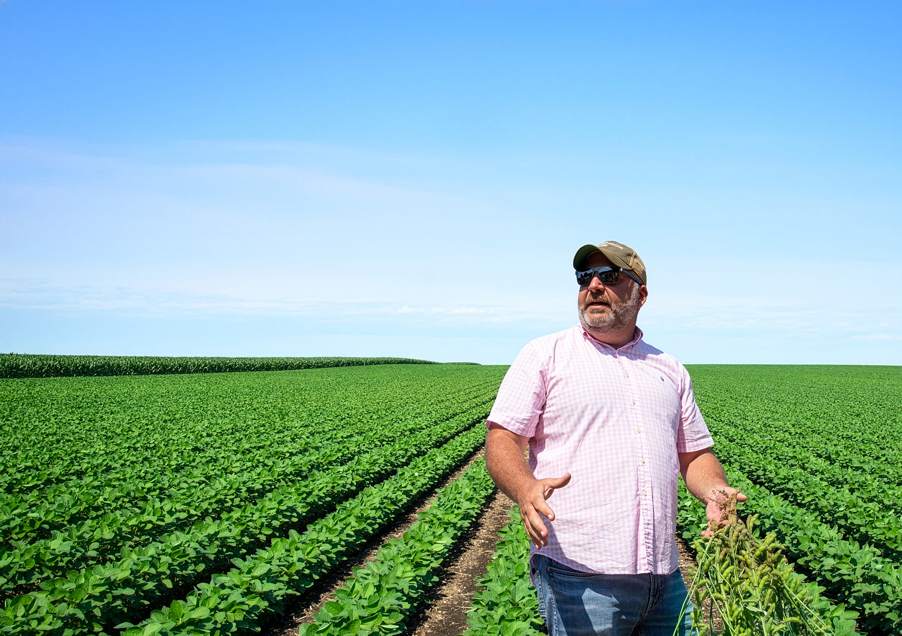 Zachary Cavosi - Farmer standing in a soybean field