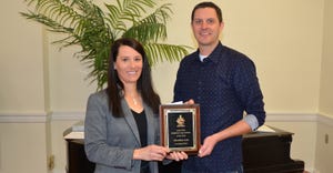 Tina Lust receives the Ohio CCA of the Year Award from Ohio CCA Board Chairman Clint Nester
