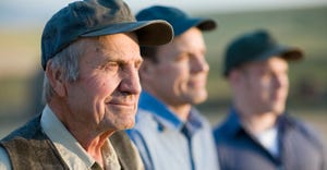 close up view of faces of three generations of male farmers