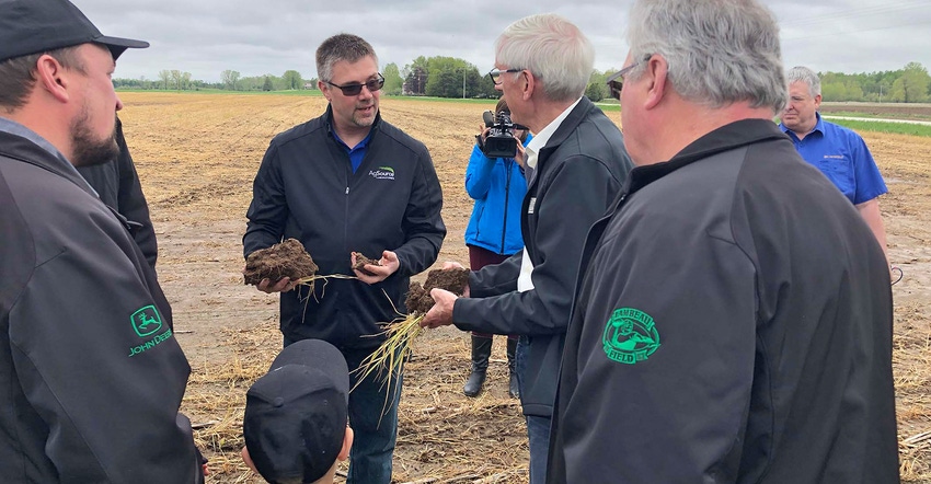 CCA Nick Guilette speaks with farmers and Governor Tony Evers
