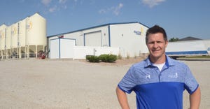 Ben Benson, Big Cob Hybrids president and owner, stands in front of one of the company's warehouses at its headquarters in Se
