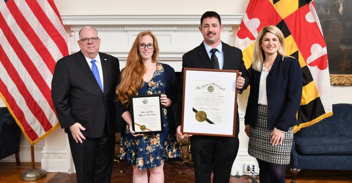 Gov. Larry Hogan and Julie Oberg, deputy ag secretary, present official citations to Tiffany and Todd Durbin of White Hall Fa Gov. Larry Hogan and Julie Oberg, deputy ag secretary, present official citations to Tiffany and Todd Durbin of White Hall Fa