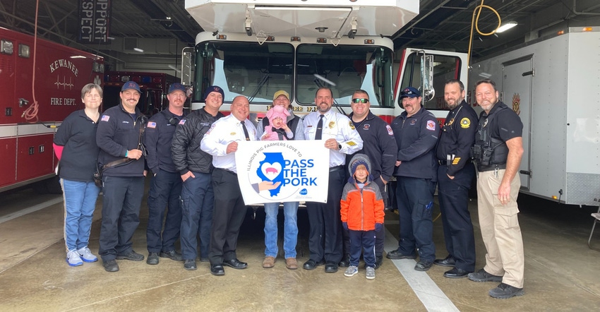 Corbin Uitermarkt gifting ribs and pulled pork sandwiches to the Kewanee Police Department and Kewanee Fire Department