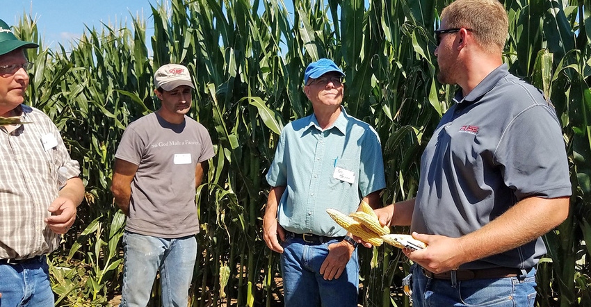 Jason Lee, Agco agronomist, talks with attendees at the Schmidt & Sons Agco Crop Tour Jason Lee, Agco agronomist, talks with attendees at the Schmidt & Sons Agco Crop Tour