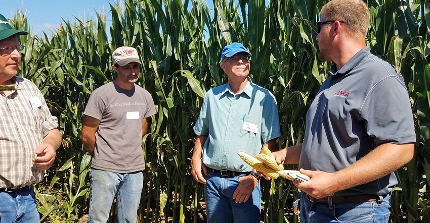 Jason Lee, Agco agronomist, talks with attendees at the Schmidt & Sons Agco Crop Tour